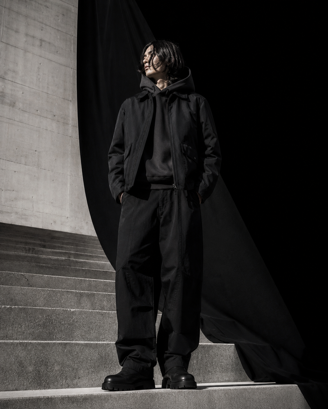 Community member in black outerwear