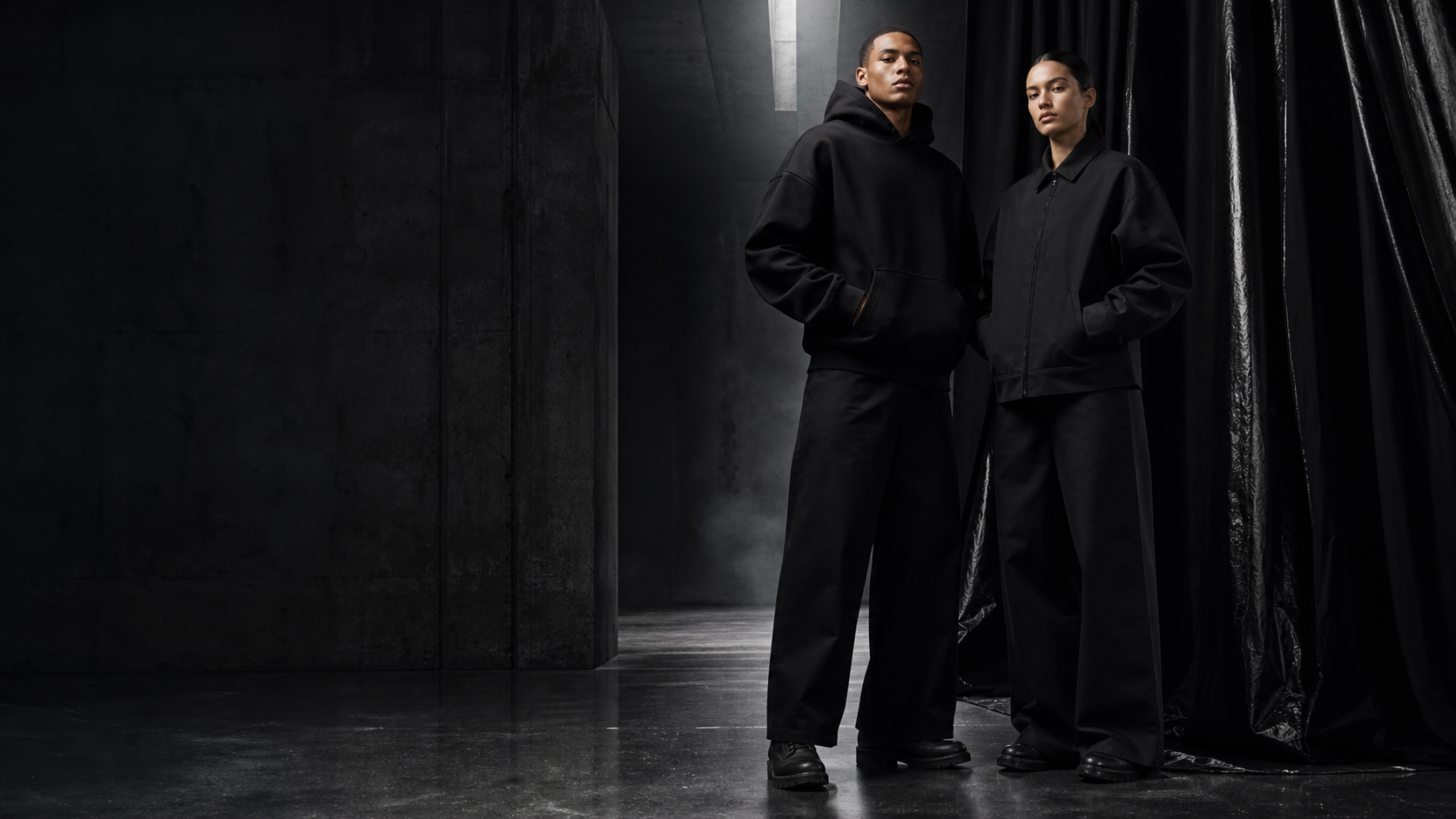 Two people wearing the INVISABLE Life black core collection